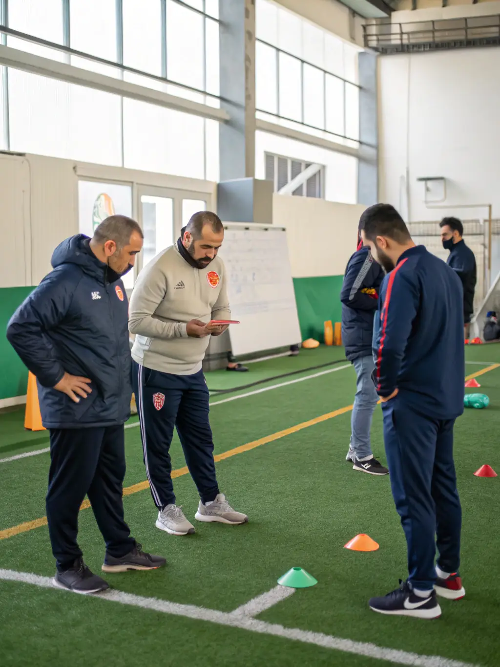 An image of coaches and referees participating in a training workshop, emphasizing the importance of qualified personnel in rugby.